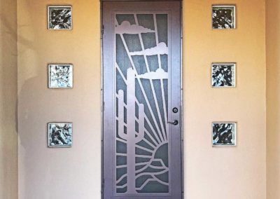Modern front door with decorative glass panels.