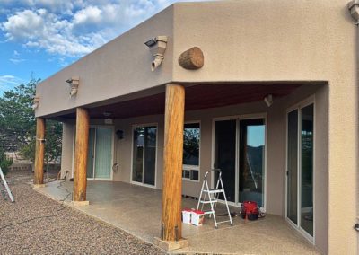 Southwestern style home exterior with patio under renovation.