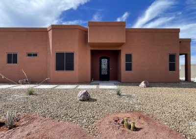 Southwestern-style house with desert landscaping.