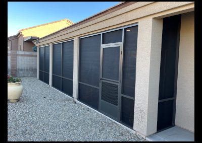 Screened patio in a residential backyard.