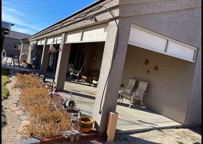 Suburban home exterior with patio and garage.
