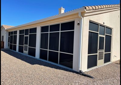 House with large screened-in patio area.
