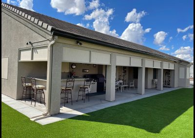 Outdoor patio with furniture and barbecue grill.