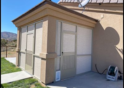 Suburban home with screened-in patio and satellite dish.
