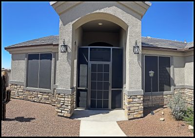 Modern home entrance with stone accents.