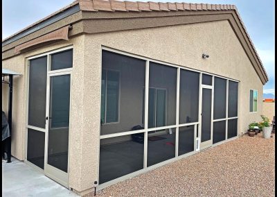 Screened patio enclosure on suburban home.