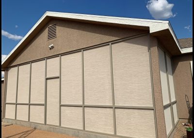 Tan suburban house with large garage door